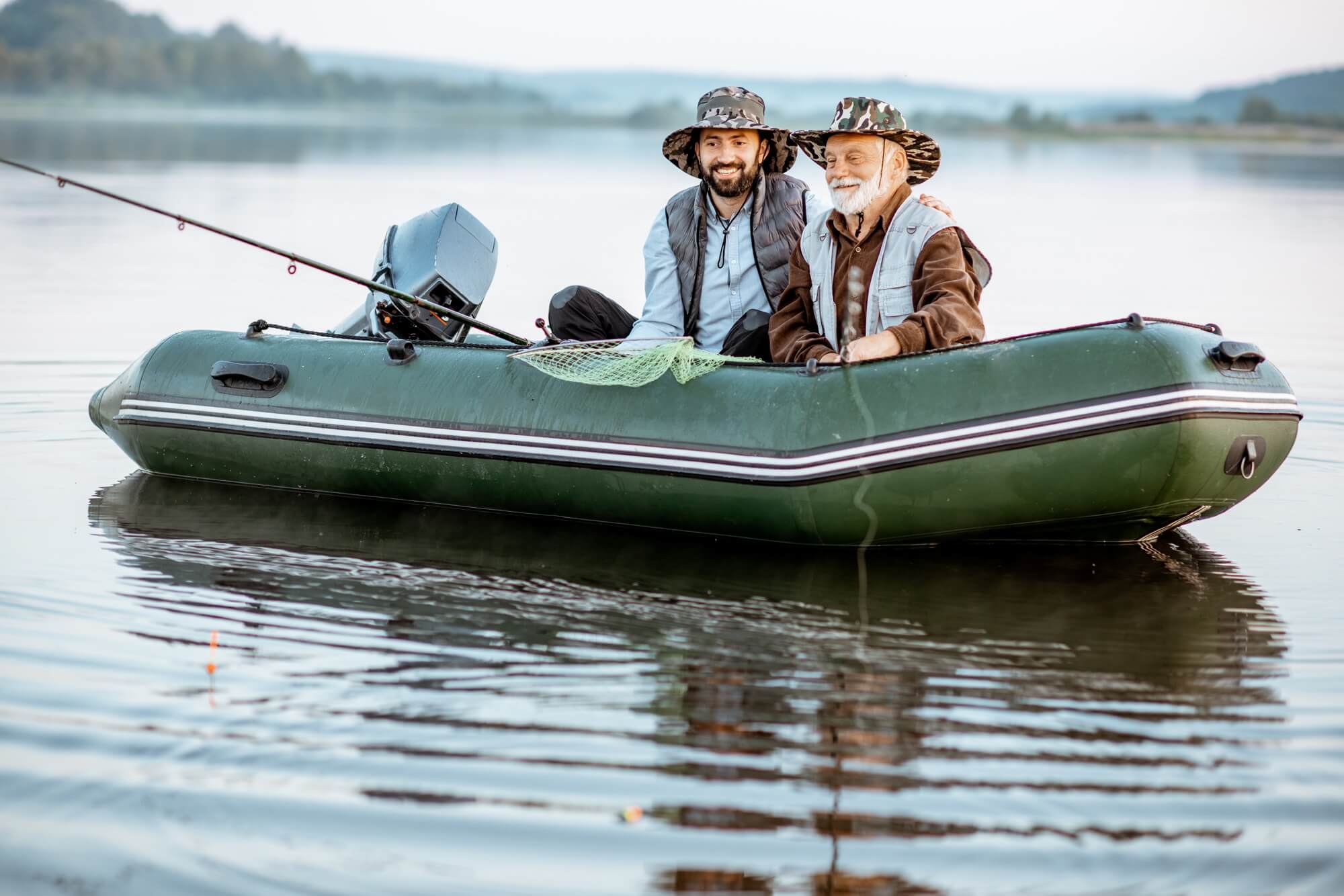 Grandfather with son fishing on the boat